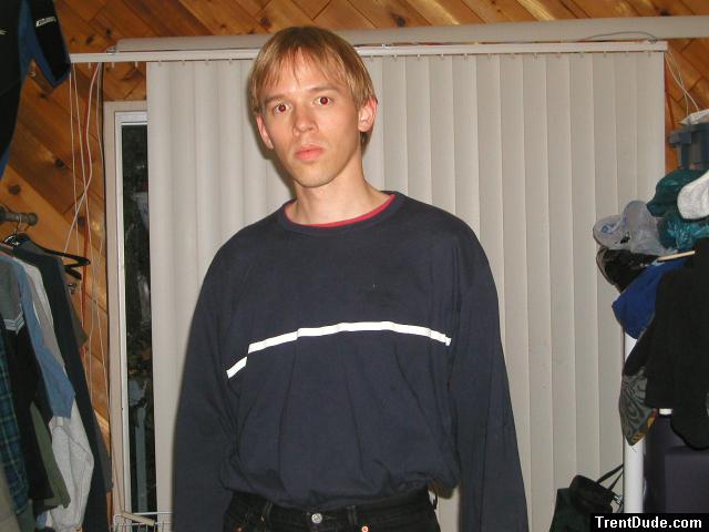 Trent in a blue shirt and black Levi's jeans