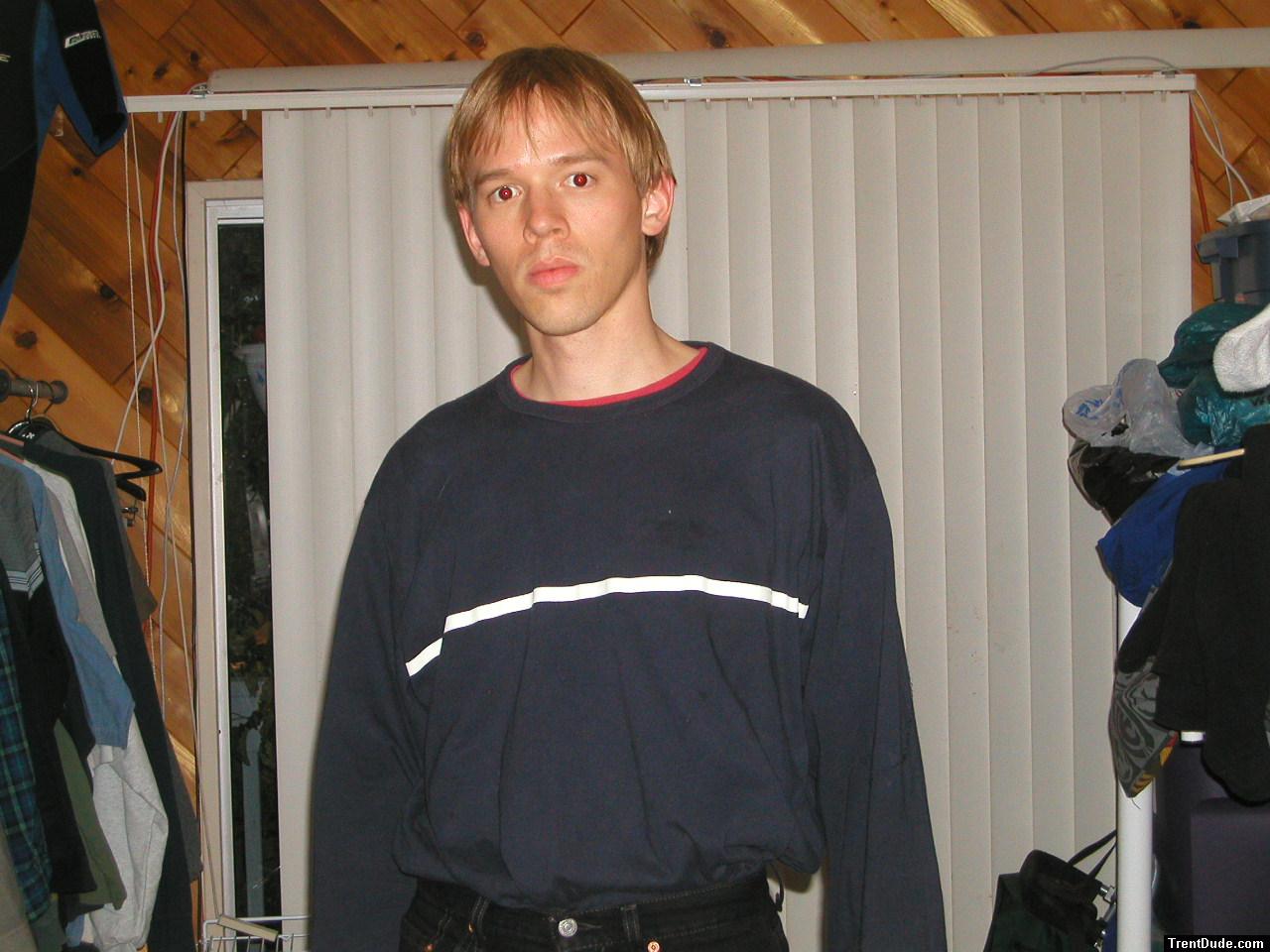 Trent in a blue shirt and black Levi's jeans