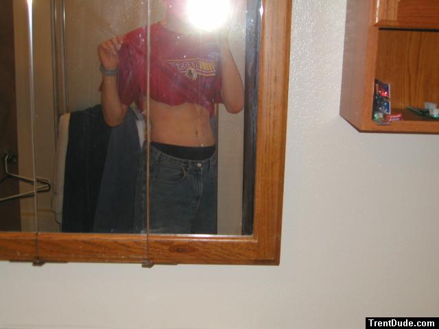 Trent with jeans in the mirror