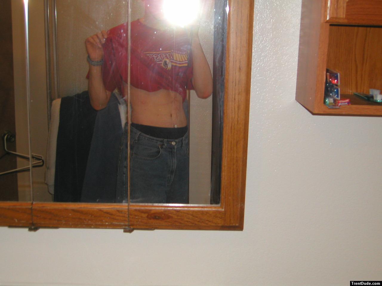 Trent with jeans in the mirror