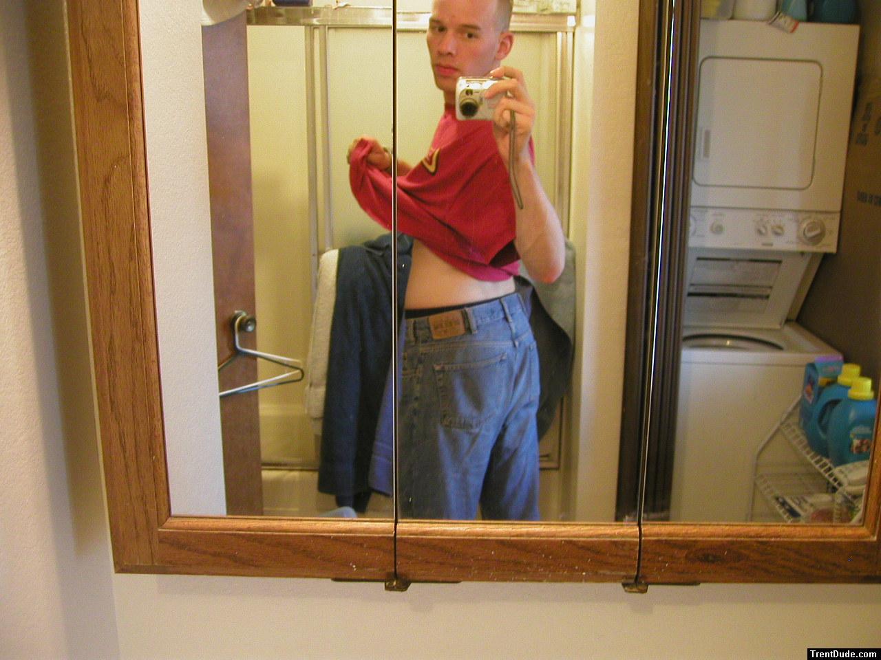 Trent with jeans in the mirror