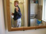 Taking a photo in the mirror wearing tan Wrangler jeans