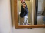 Taking a photo in the mirror wearing tan Wrangler jeans