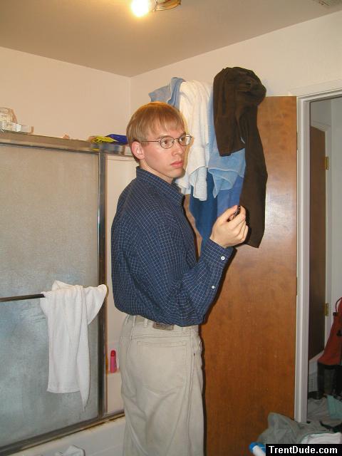 Tan Wrangler jeans and glasses