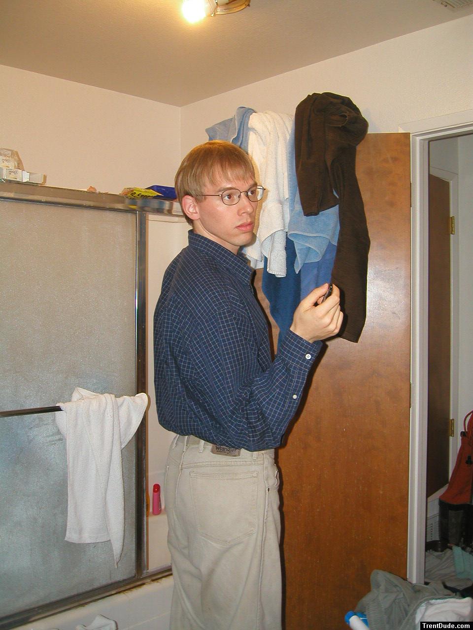 Tan Wrangler jeans and glasses