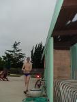 Walking in his speedo