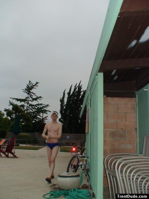 Walking in his speedo