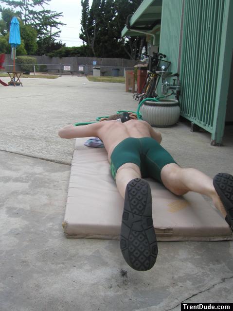 push-ups in a Nike green swim jammer