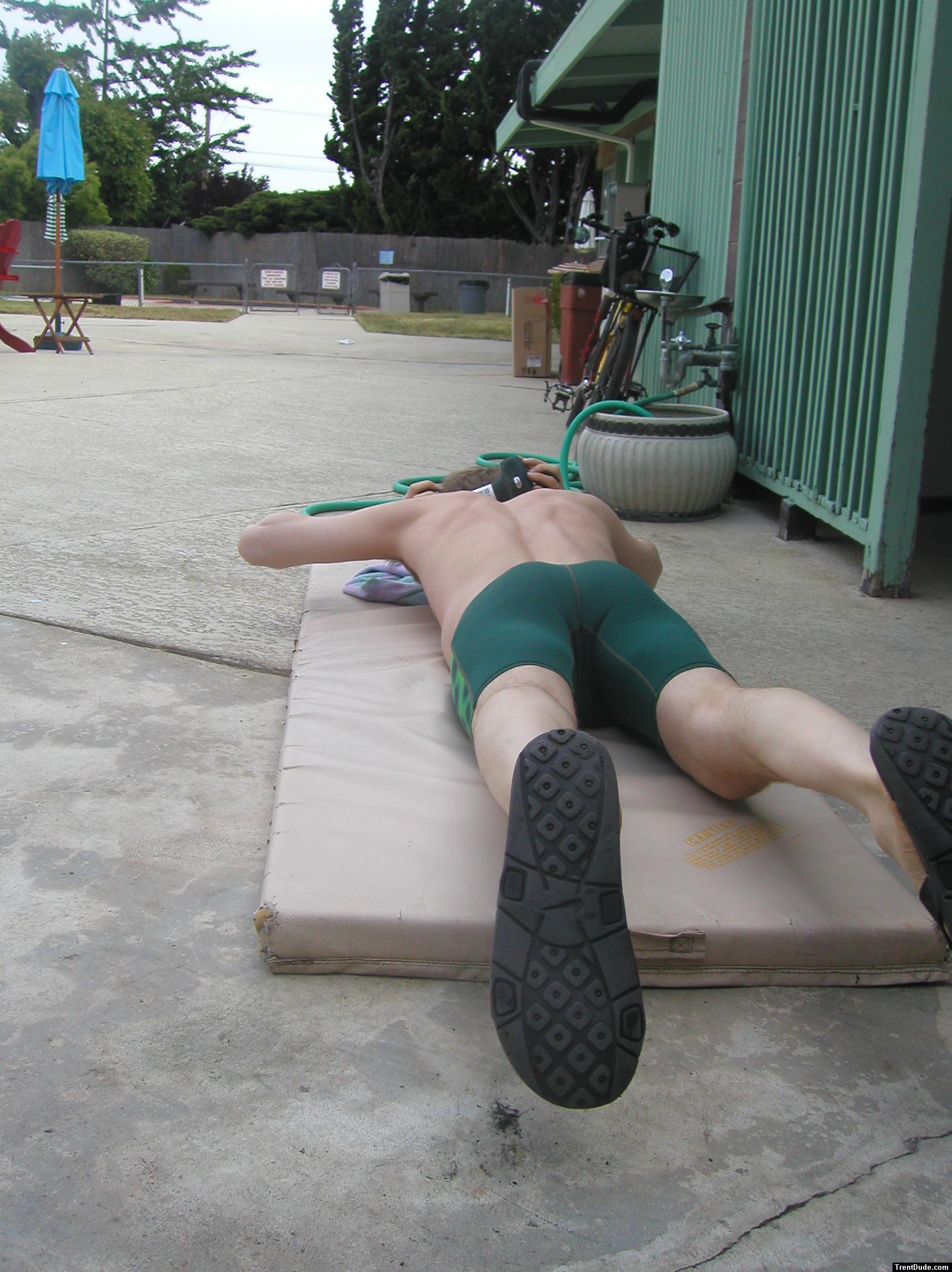 push-ups in a Nike green swim jammer