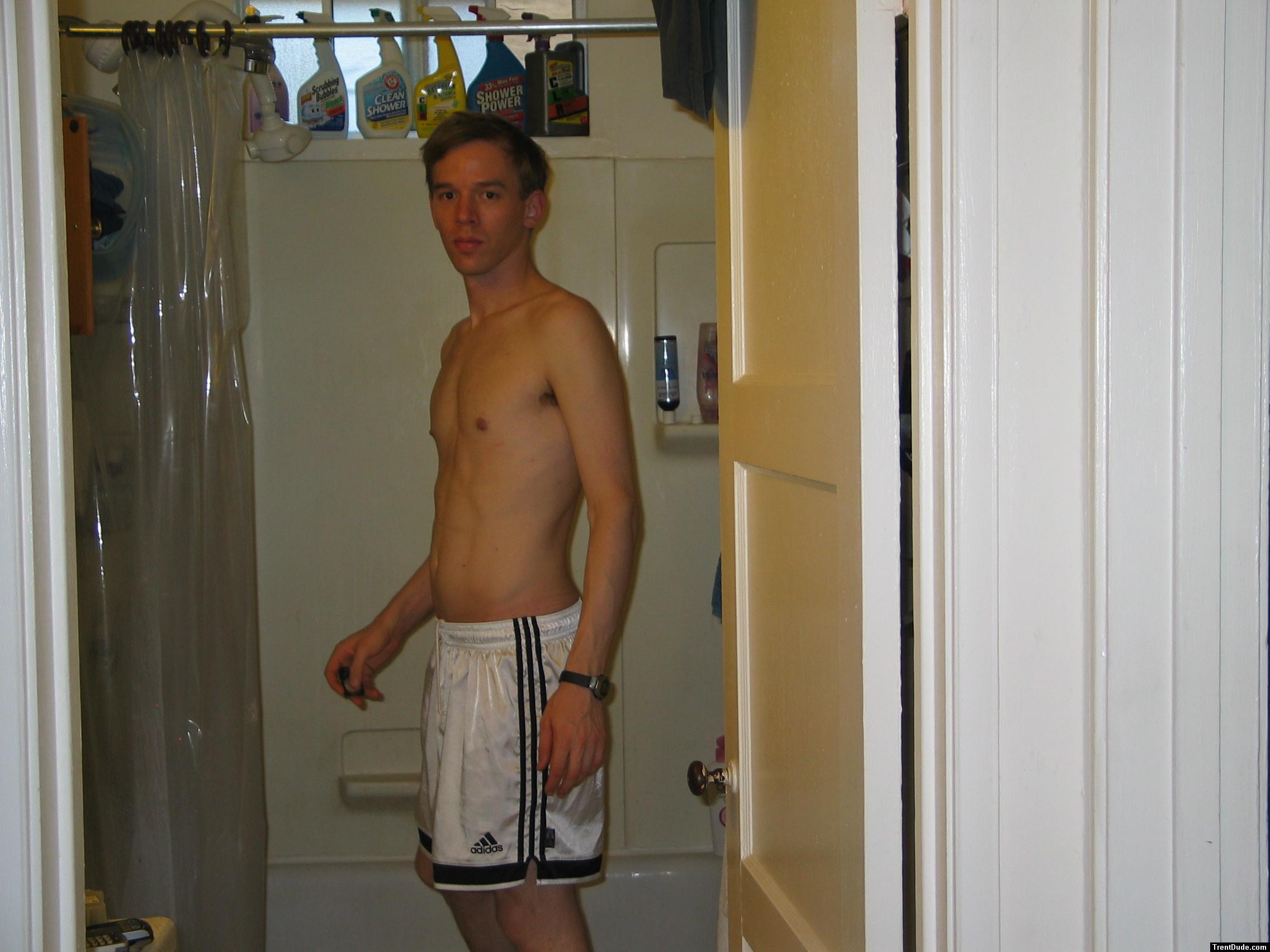 Shirtless in white addidas shorts