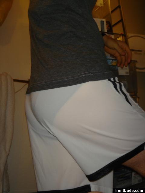 ``White addidas shorts, wet blue hanes underneath