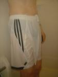 `White addidas shorts, wet blue hanes underneath