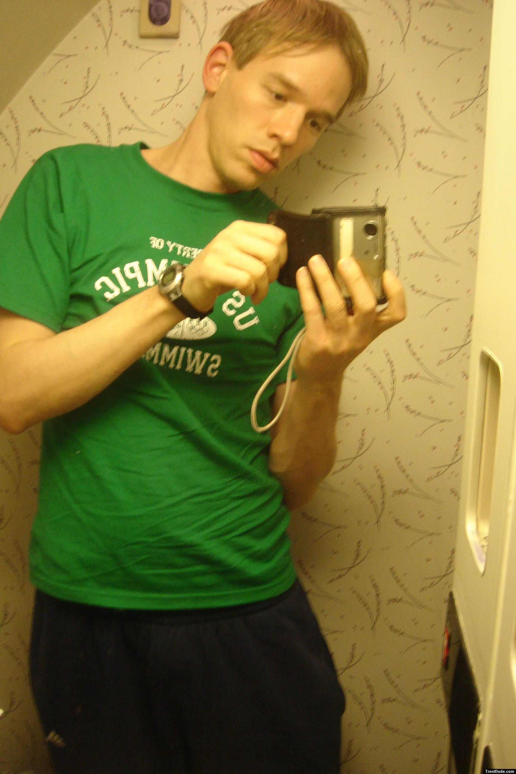 getting undressed in an airplane bathroom