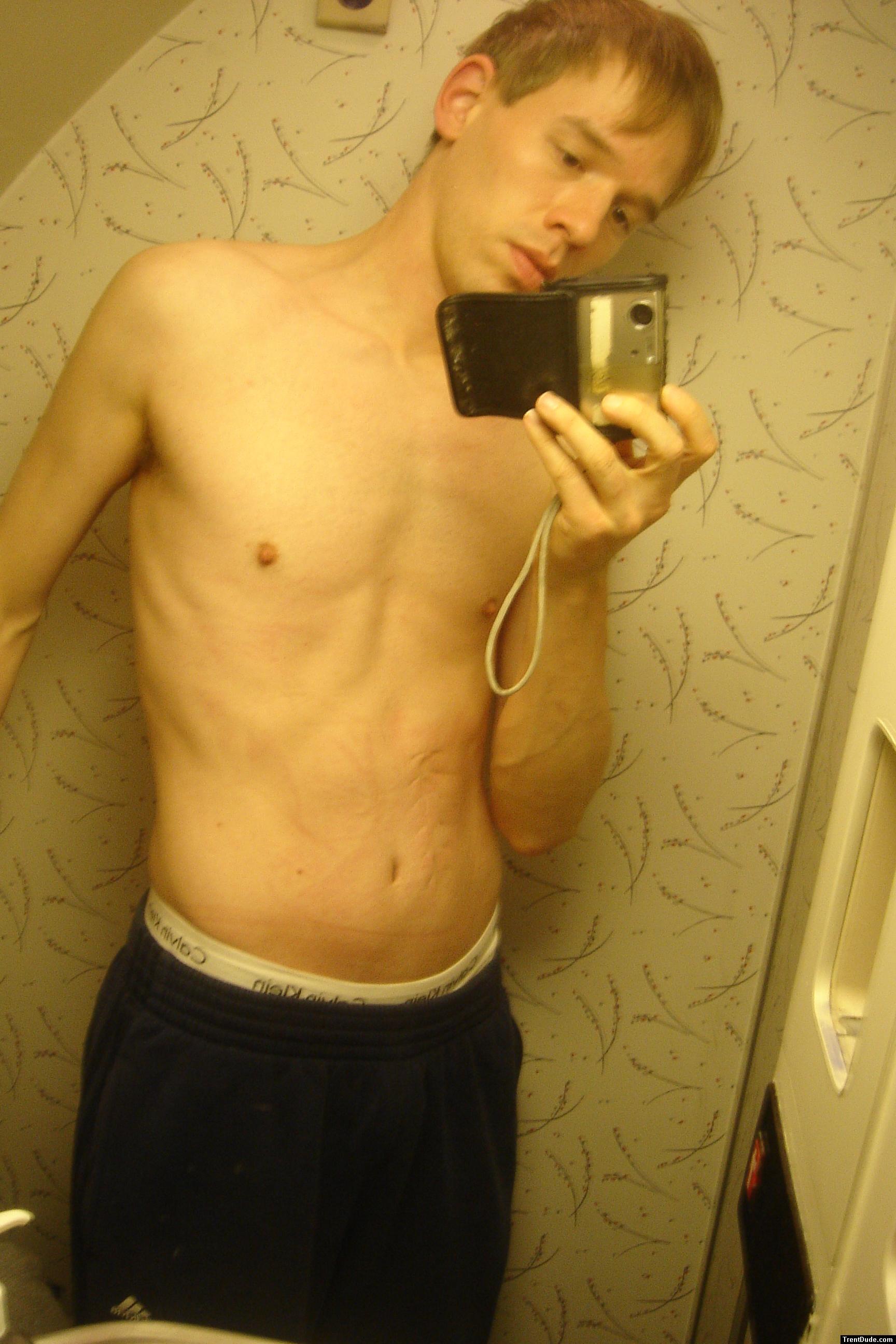 Blue sweat pants and calvin Klein breifs on the airplane