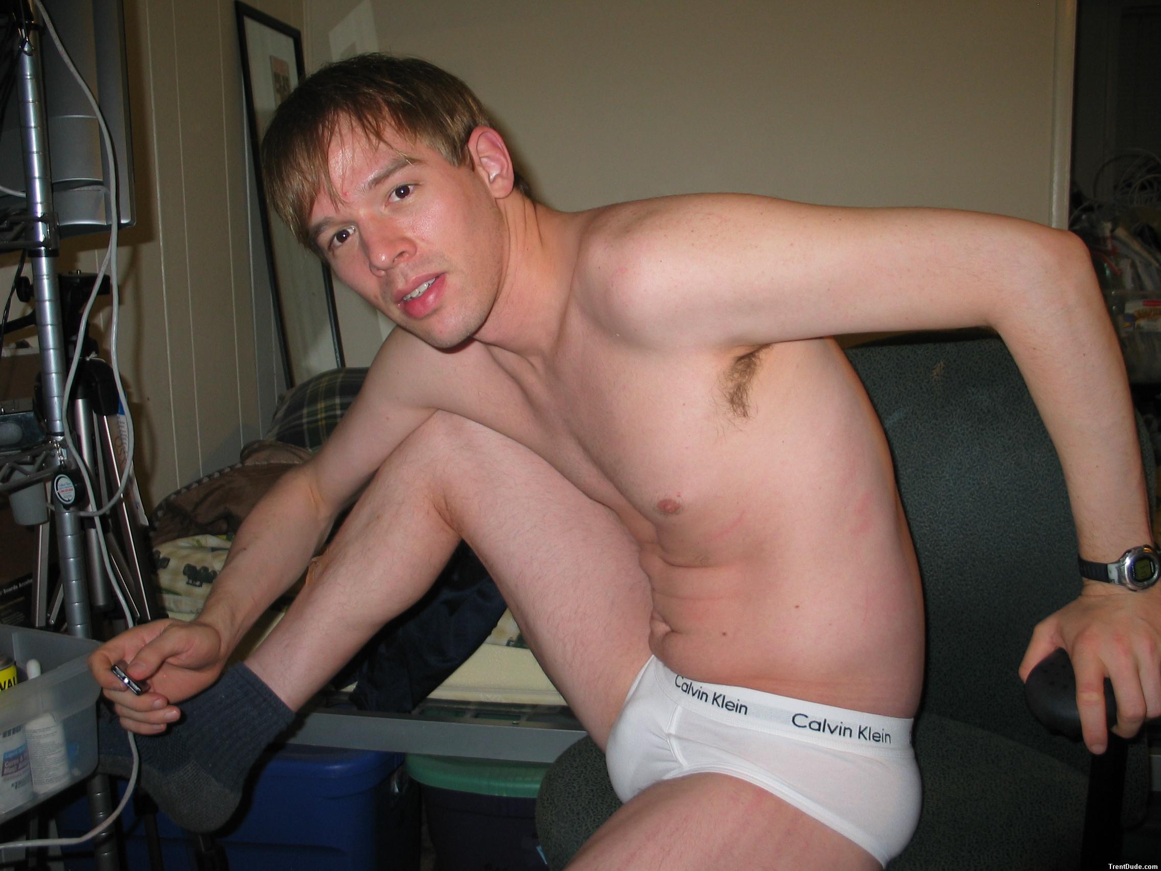 Stretching his legs in Calvin Klein white briefs