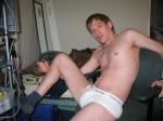 In a chair in Calvin Klein briefs