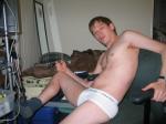 In a chair in Calvin Klein briefs