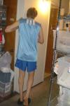 Foot heel.  Back of blue tank top. Toned legs.