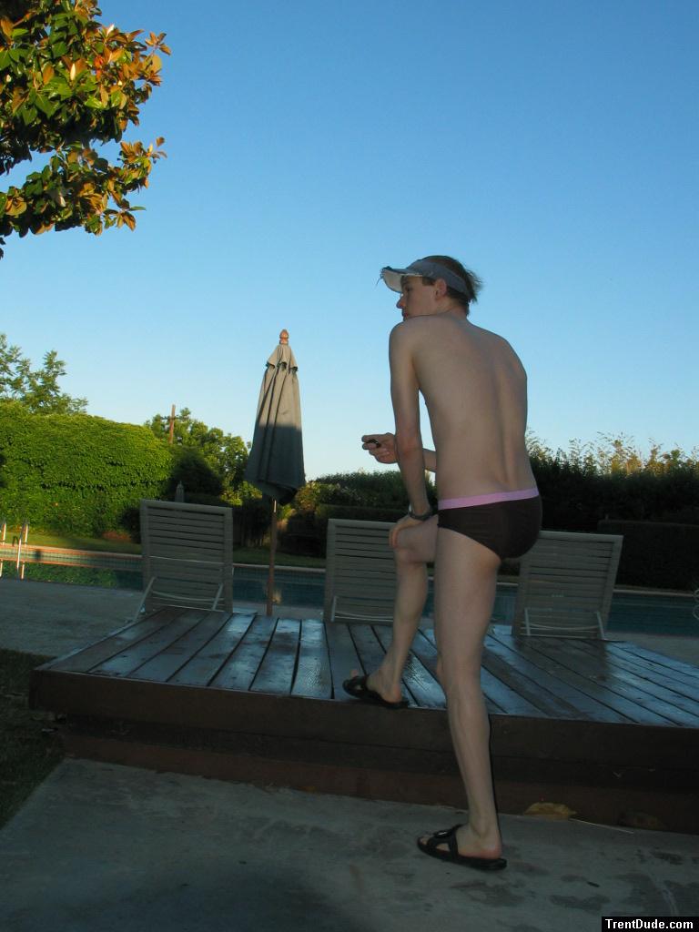 Watching the sunrise in his swimsuit