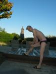 Stretching his calf muscles