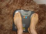 Trent's feet while weighing himself on a scale
