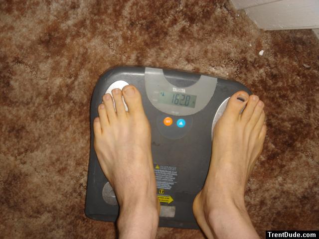 Trent's feet while weighing himself on a scale