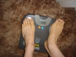 Trent's feet while weighing himself on a scale