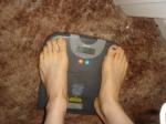Trent's feet while weighing himself on a scale