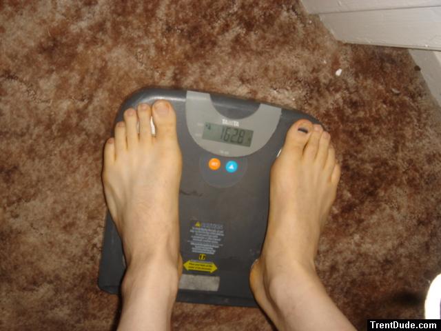 Trent's feet while weighing himself on a scale