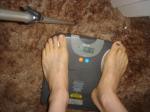 Trent's feet while weighing himself on a scale
