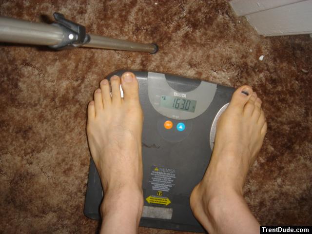 Trent's feet while weighing himself on a scale