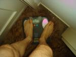 Trent's feet while weighing himself on a scale