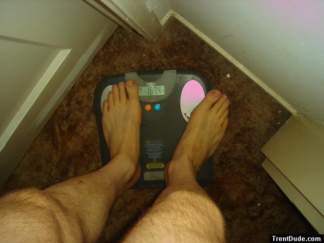 Trent's feet while weighing himself on a scale