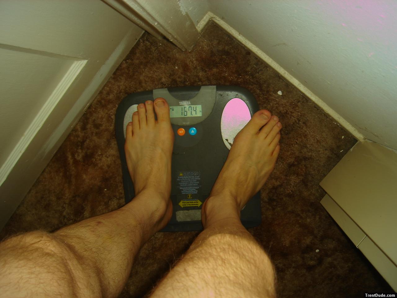 Trent's feet while weighing himself on a scale