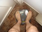 Trent's feet while weighing himself on a scale