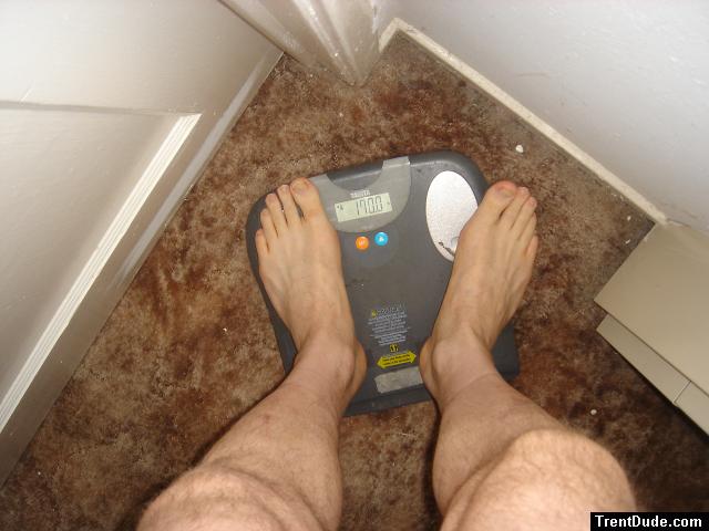 Trent's feet while weighing himself on a scale