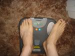 Trent's feet while weighing himself on a scale