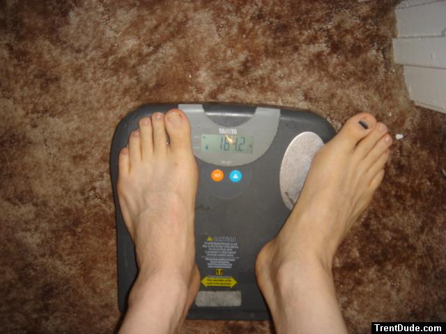 Trent's feet while weighing himself on a scale