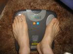 Trent's feet while weighing himself on a scale