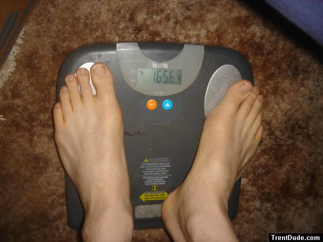 Trent's feet while weighing himself on a scale