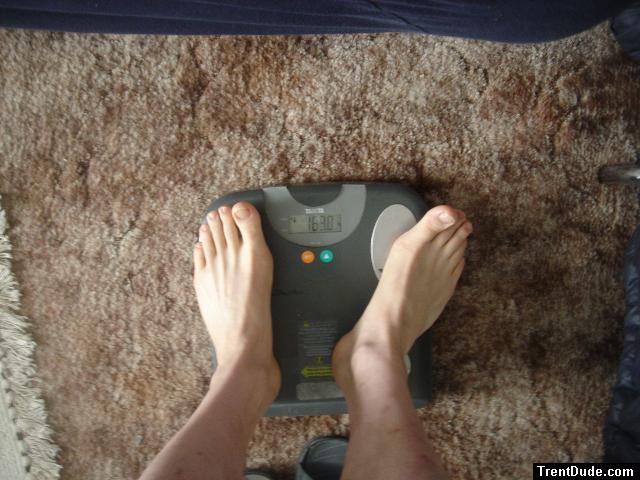 Trent's feet while weighing himself on a scale
