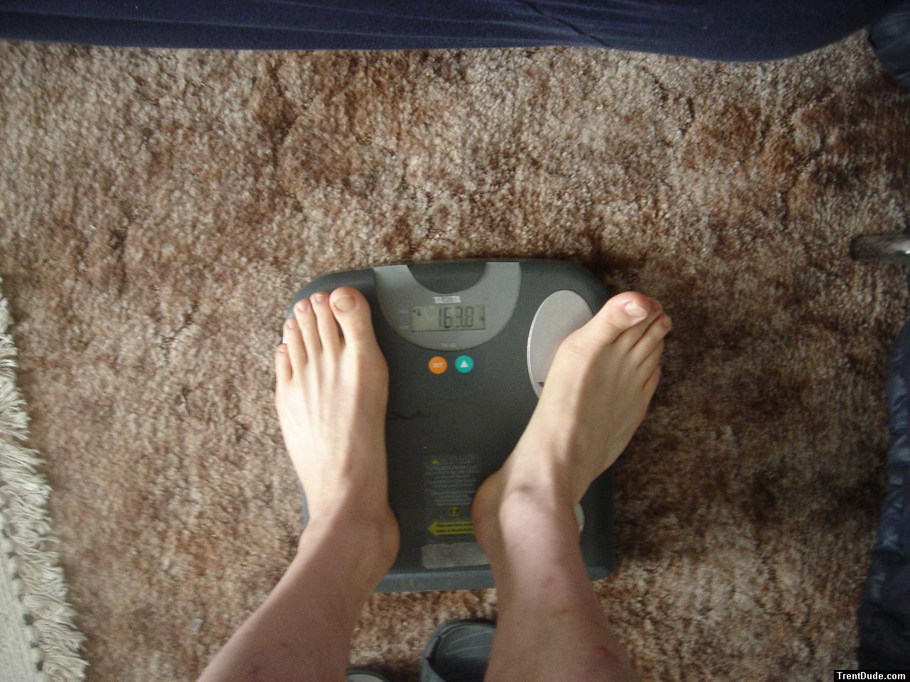Trent's feet while weighing himself on a scale