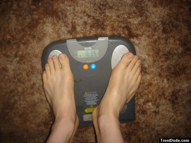 Trent's feet while weighing himself on a scale