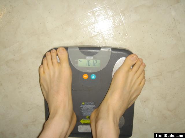 Trent's feet while weighing himself on a scale