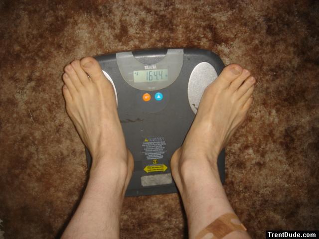 Trent's feet while weighing himself on a scale