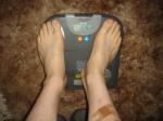 Trent's feet while weighing himself on a scale