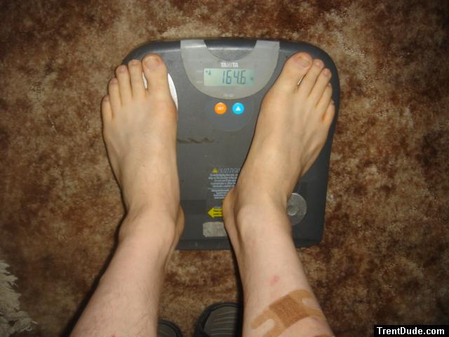 Trent's feet while weighing himself on a scale