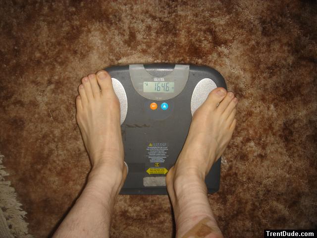 Trent's feet while weighing himself on a scale