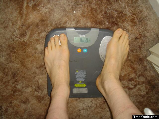 Trent's feet while weighing himself on a scale