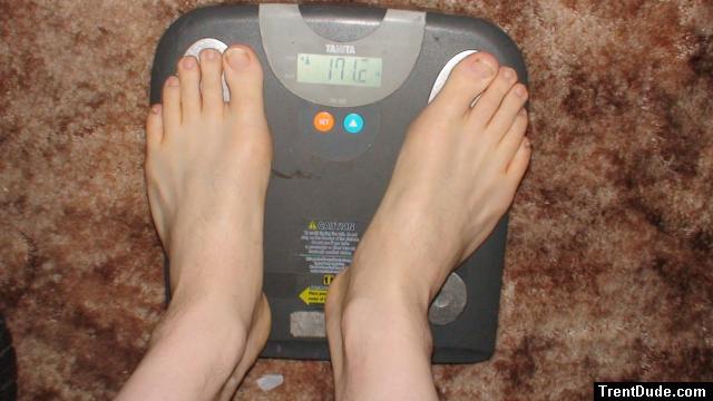Trent's feet while weighing himself on a scale